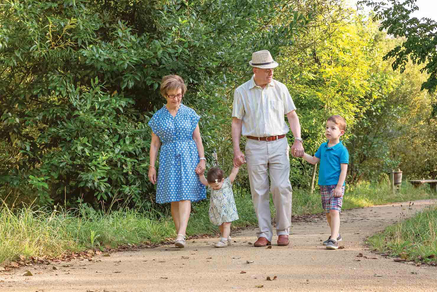 grandparents walking hand in hand with their grandkids guaranteed retirement income